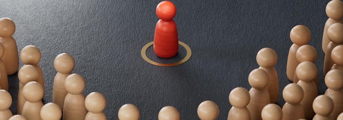 Wooden figurines representing class action or mass tort