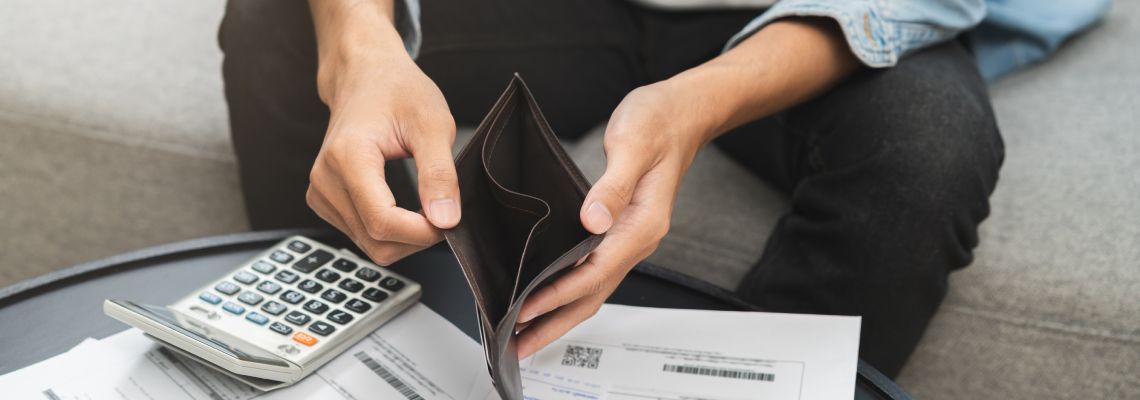 Man with empty wallet in hand