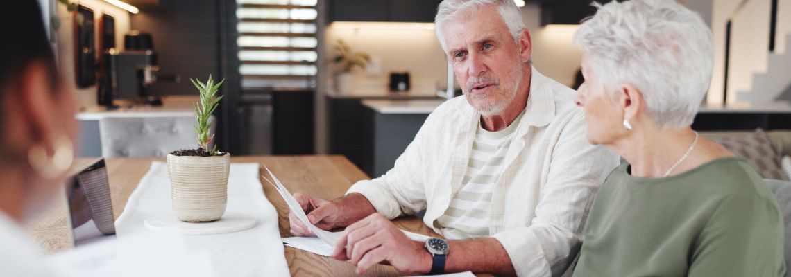 Senior couples consulting with attorney
