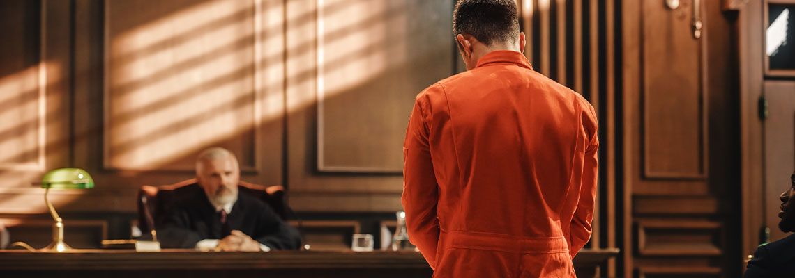 Criminal trial proceeding in courtroom