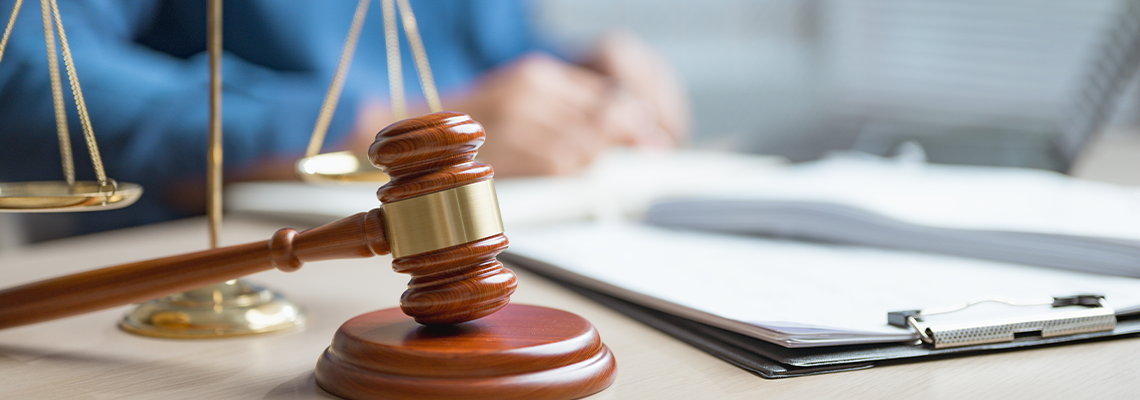 Hammer judge and case file on lawyer's table