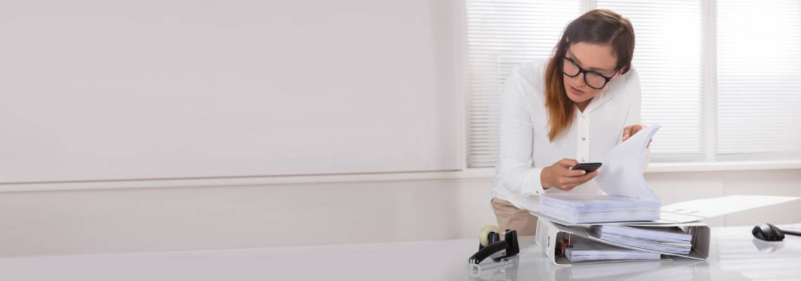 Businesswoman Taking Photo's Of Document Secretly
