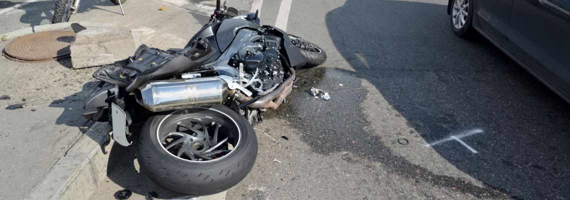 Motorcycle crash on road