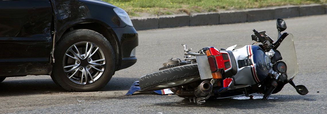 Crashed motorcycle on road
