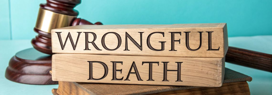 Wrongful Death wooden block with gavel in table