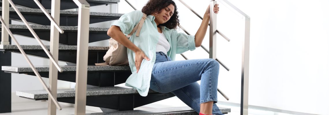 Women hurt her back after slip and fall in staircase