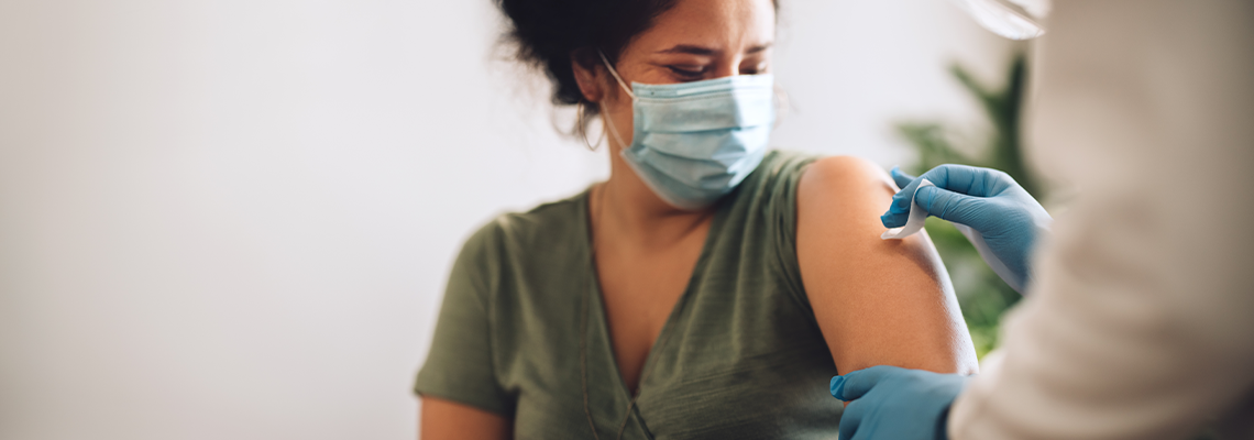 Woman Receiving Covid Vaccination at Home