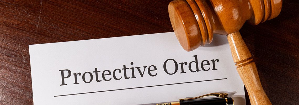 Protective order file and gavel on table
