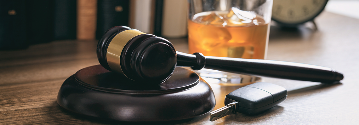 Gavel on a desk with car keys