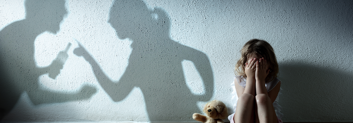 Little Girl Crying With Shadow Of Parents Arguing