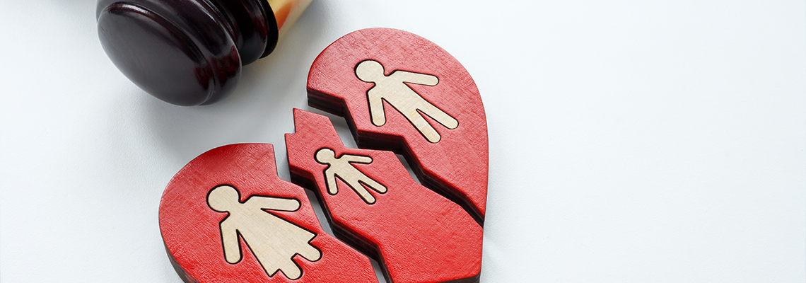 A broken heart and a gavel as a symbol of divorce, alimony and custody