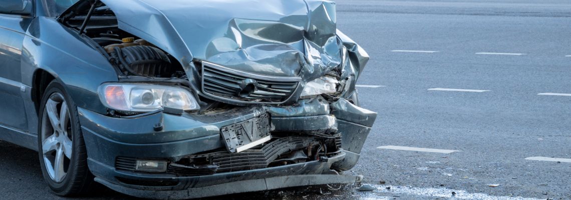Damaged car after accident in road