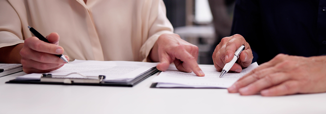 Legal broker reviewing contract documents