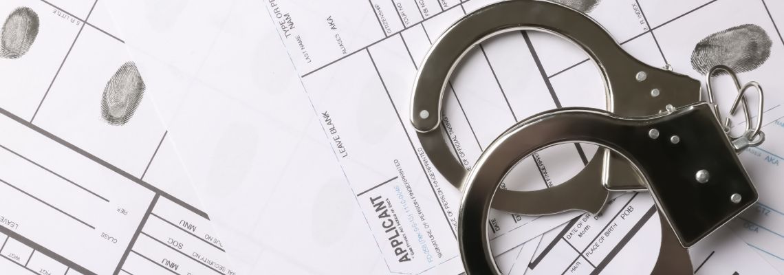 Handcuffs and fingerprint on record sheet