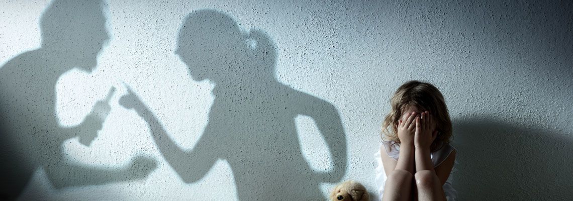 Small Child Crying With Shadow Of Parents Arguing