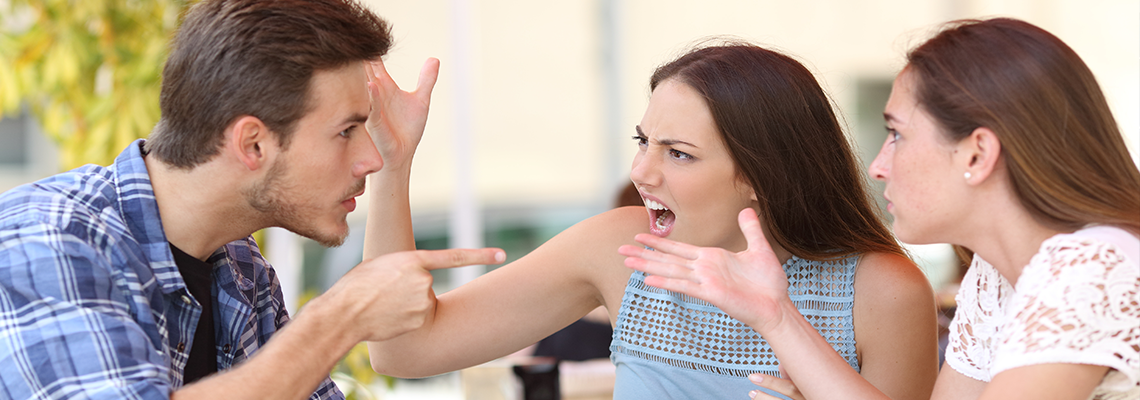 Angry friends arguing in a coffee shop.