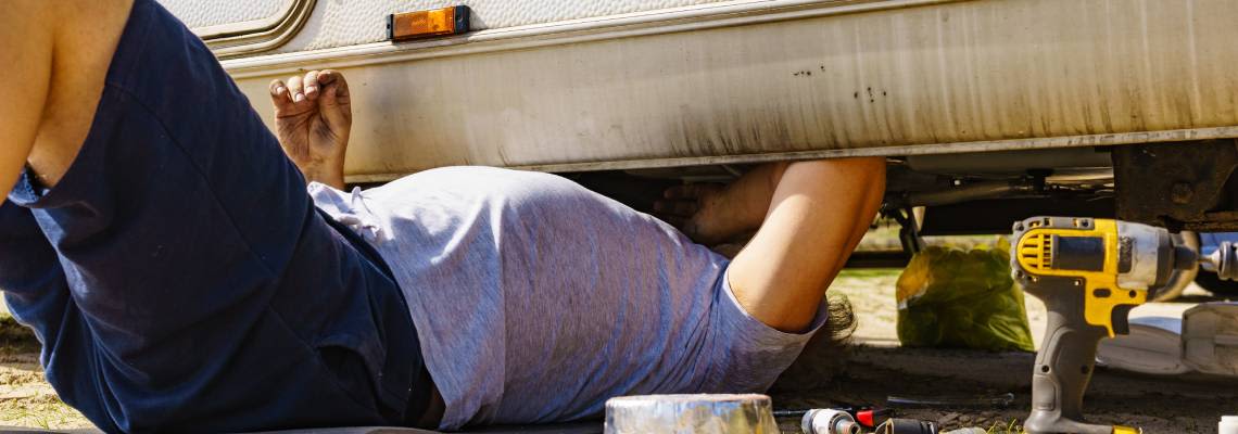 Man repairing RV van