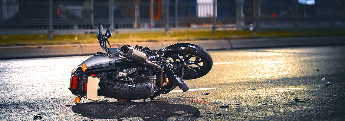 Motorcycle lying on asphalt after an road accident