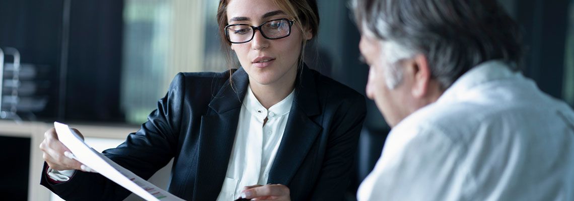 Old man taking legal advice with attorney