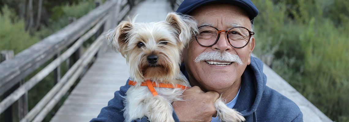 Old man with his pet dog