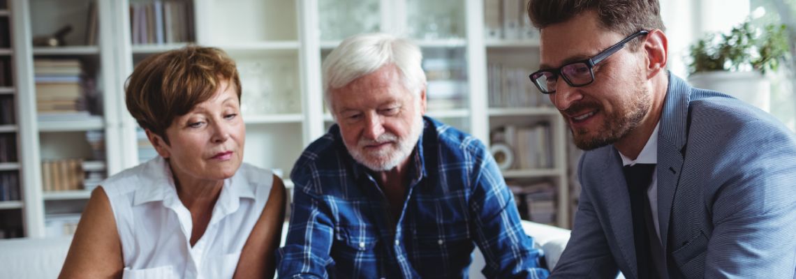Old couples consulting with attorney for estate planning