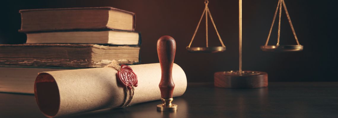 Last will with notary stamp and scale of justice