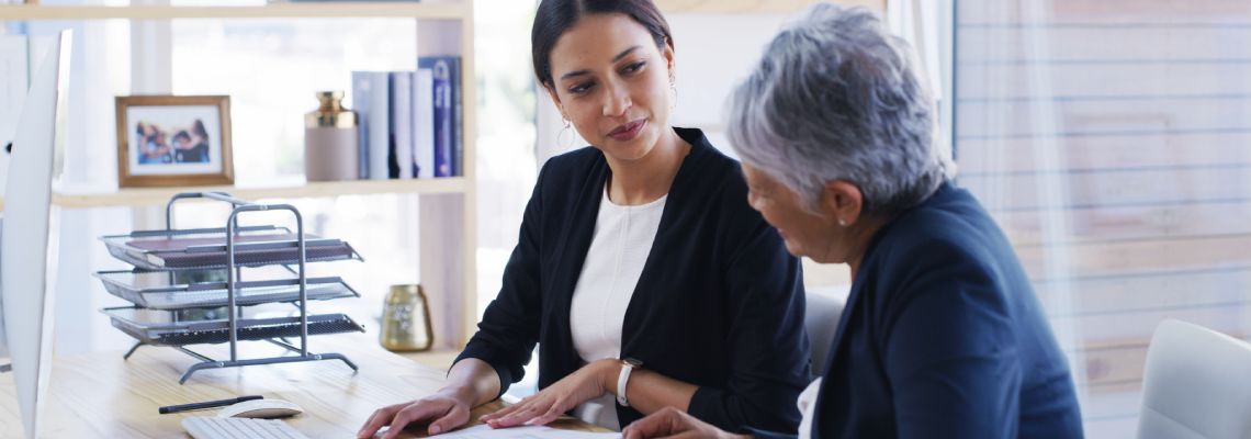Old women consulting with an attorney