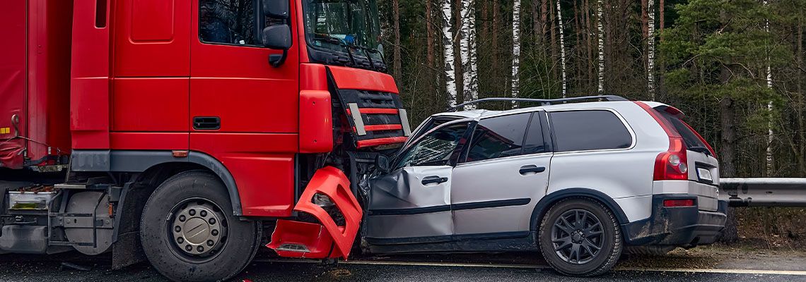 Collison between car and truck