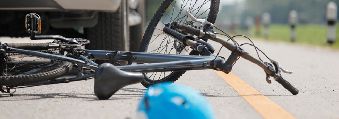 Crashed bicycle on road after accident