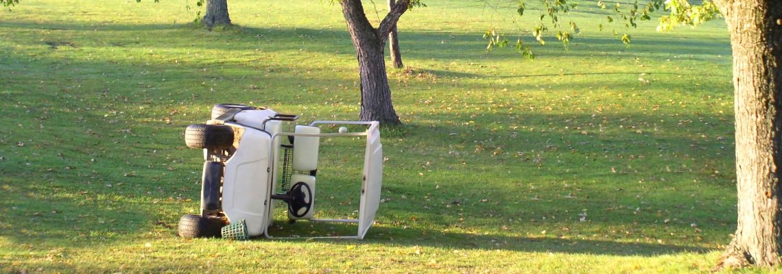 Golf Cart lying sideways after accident