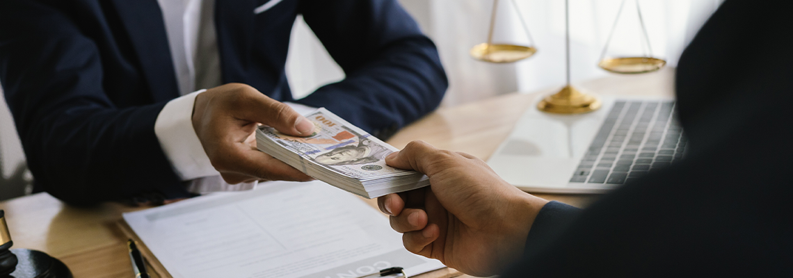 Lawyer giving advice and handing over cash during a legal meeting