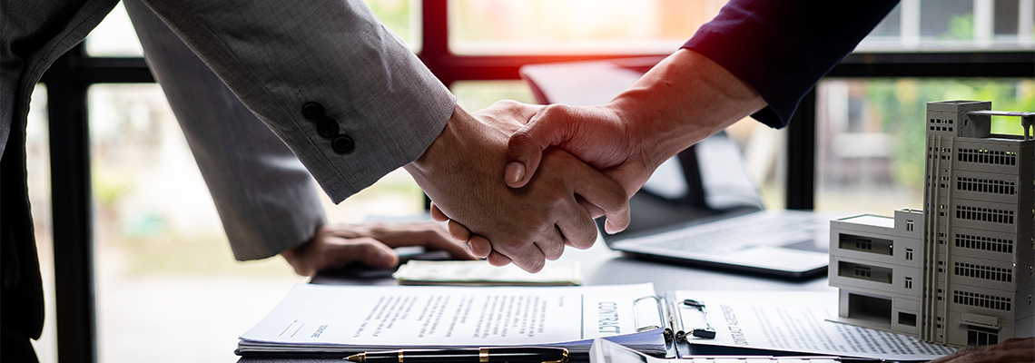 Handshake and agreement Real estate agent and client celebrating contracts completed