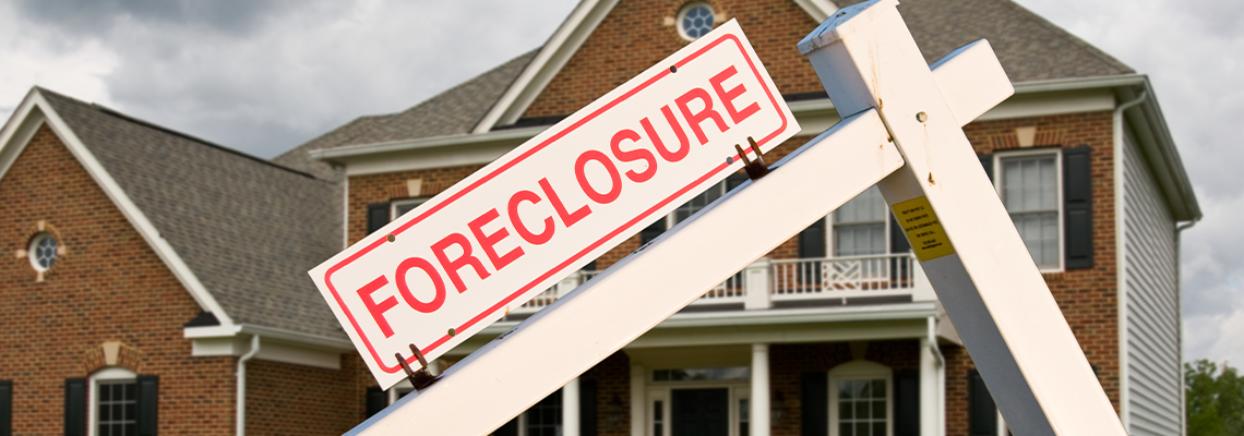 Foreclosure Sign in Front on Modern House