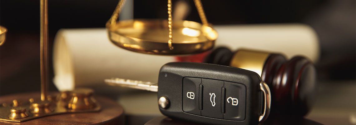 Close up of judge gavel and car keys