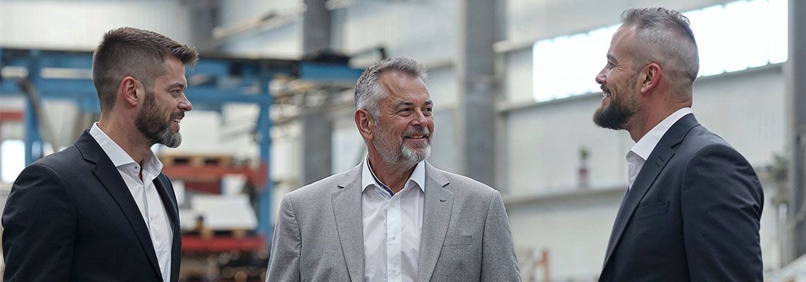 Men discussing company inheritance