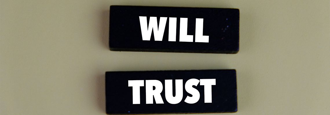 Wooden block with the words will and trust