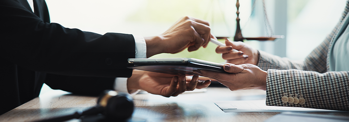 Hands, people and meeting with tablet, legal office and contract review