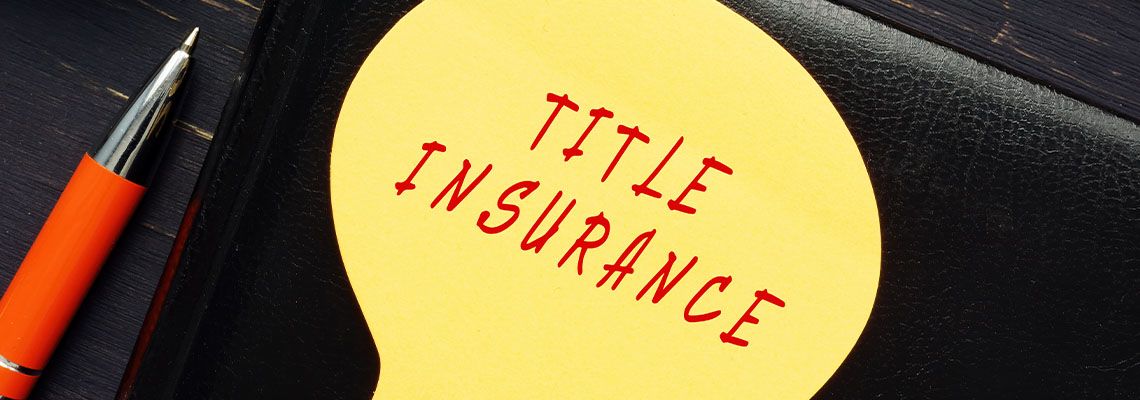 TITLE INSURANCE written on a paper