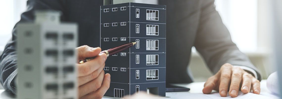 Agent Presenting Commercial Real Estate Model to Client