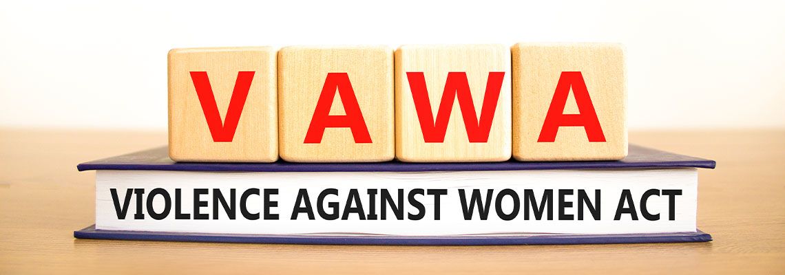 VAWA violence against women act words on book and wooden cube