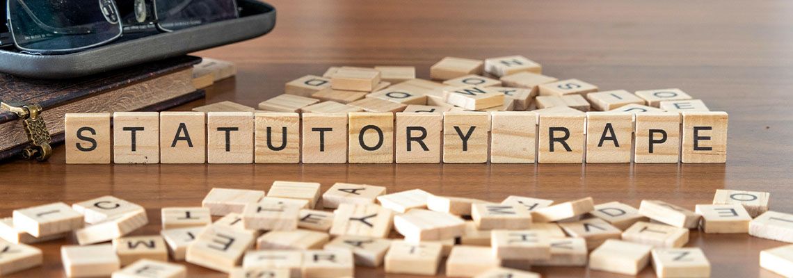 Statutory rape word or concept represented by wooden letter tiles
