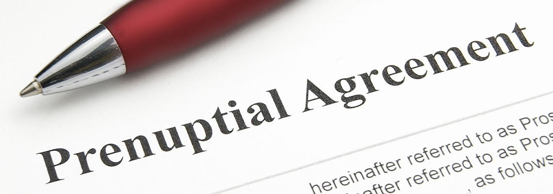 Closeup of A Marriage Prenuptial Agreement Form and A Pen