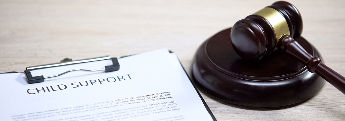 Child Support Document Table, Gavel Lying on Sound Block