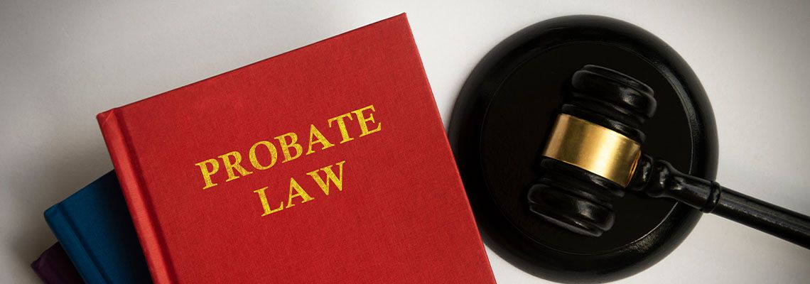 Probate law book with gavel on white background