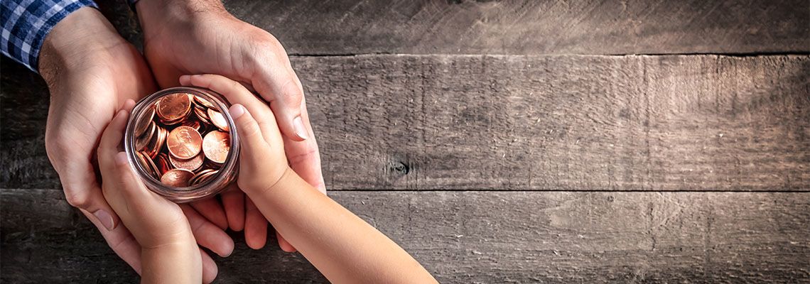 Father Giving Jar Of Coins To Child to symbolize inheritance