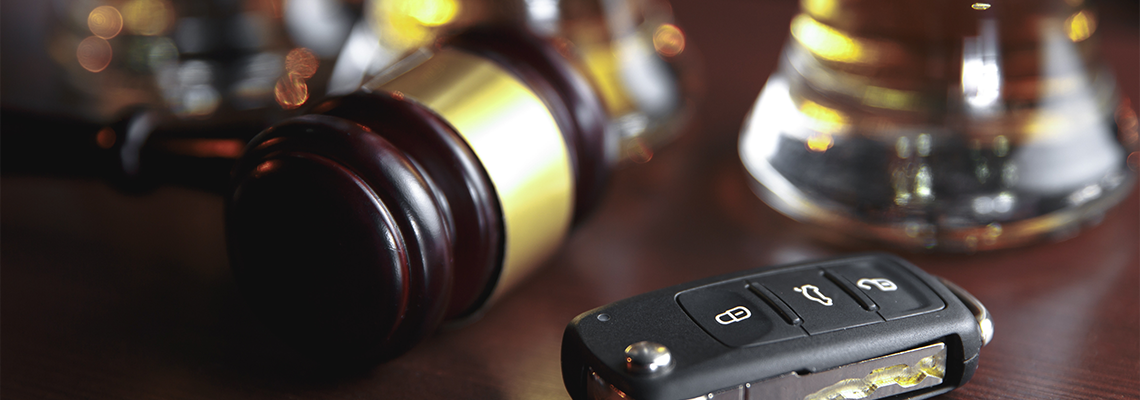 Car key on a wooden table, pub background