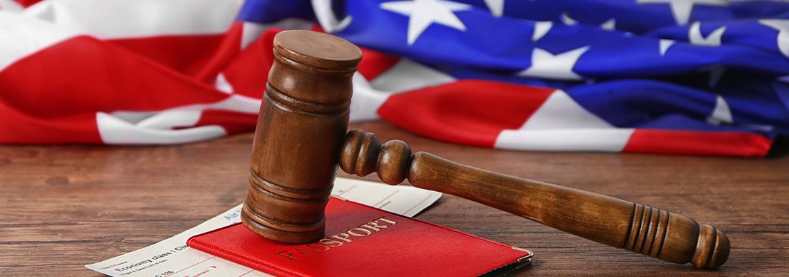 Gavel, passport, ticket and American flag on table