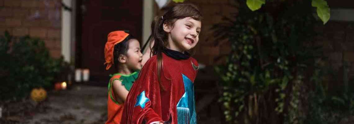 Girls trick-or-treating on Halloween