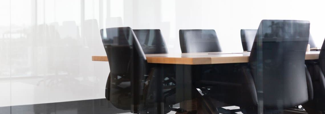 Conference room with table and office chairs