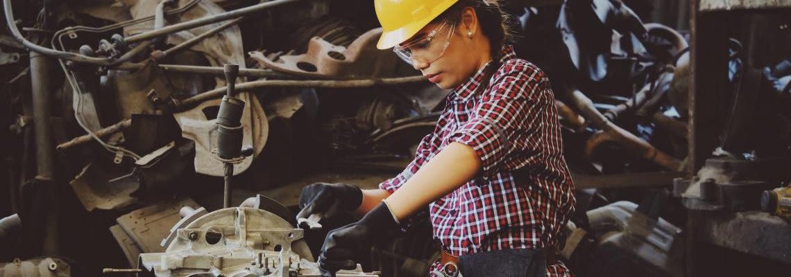 Worker using a mechanical machine